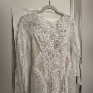Brand New never been worn can be used as wedding dress or formal dress.Lace/nude